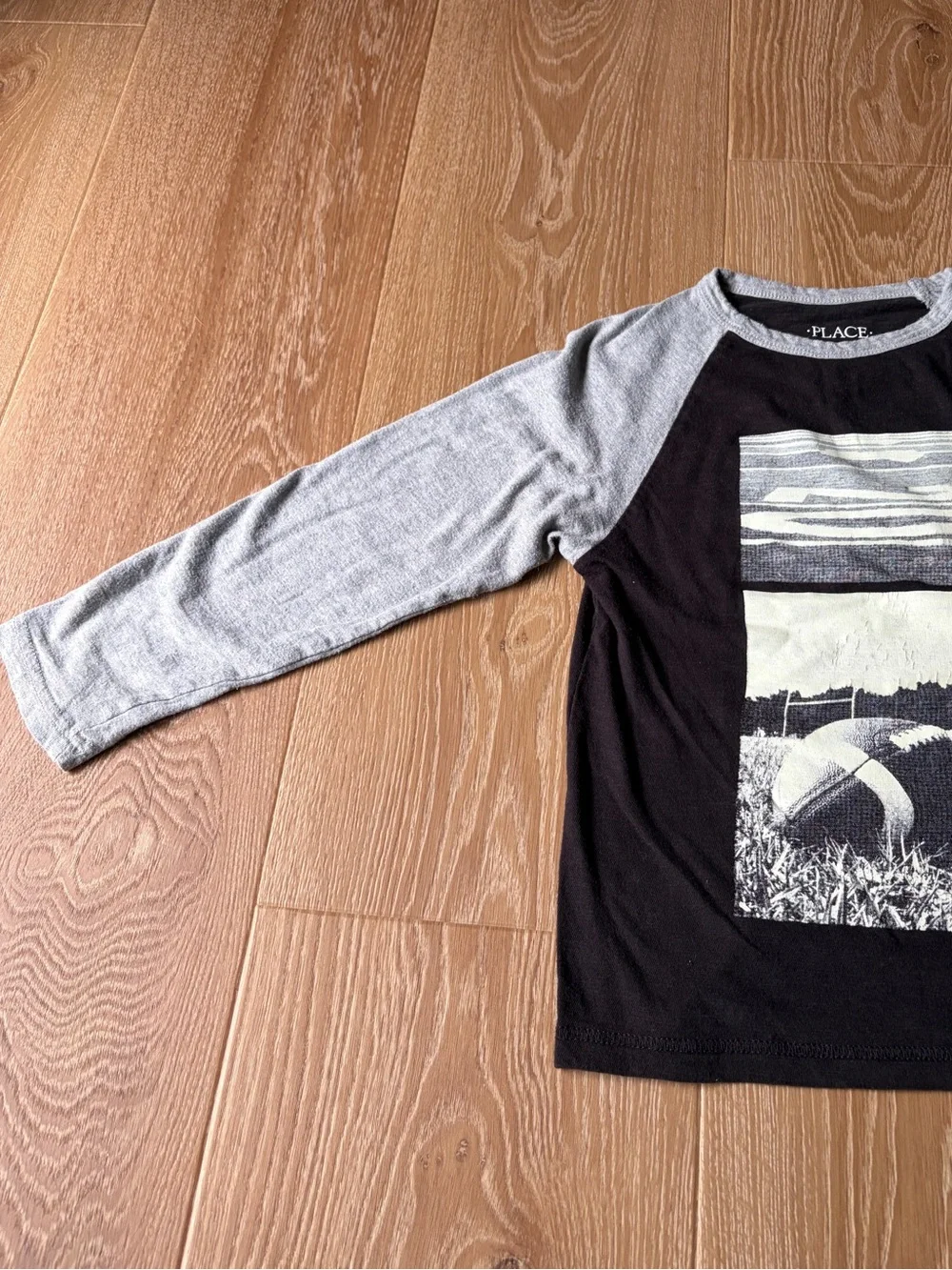The Children’s Place Football Black Tee with Gray Neckline and Sleeves, size 5/6
